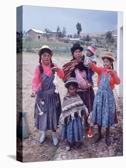 Mother and Four Children Wearing Derby Hats, Playing with Ball of Yarn, Andean Highlands of Bolivia-Bill Ray-Premier Image Canvas