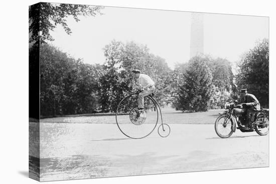 Motorcycle Cop Chases a Penny Farthing Velocipede Down a DC Street with Washington Monument in Back-null-Stretched Canvas