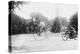 Motorcycle Cop Chases a Penny Farthing Velocipede Down a DC Street with Washington Monument in Back-null-Stretched Canvas