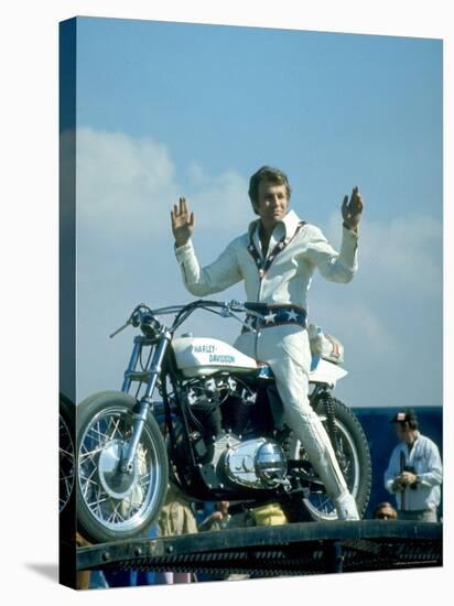 Motorcycle Daredevil Evel Knievel Poised on His Harley Davidson-Ralph Crane-Premier Image Canvas