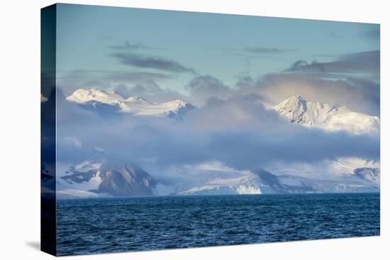 Mountain breaking through the clouds, Elephant Island, South Shetland Islands, Antarctica, Polar Re-Michael Runkel-Premier Image Canvas