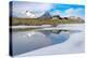 Mountain hut on shore of frozen pond during thaw, Scermendone Alp, Rhaetian Alps, Valtellina-Roberto Moiola-Premier Image Canvas