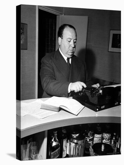 Movie Director Alfred Hitchcock Typing Script on a Portable Typewriter-Peter Stackpole-Premier Image Canvas