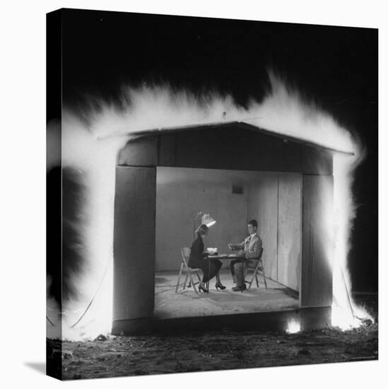 Mr. and Mrs. Andrew Andeck Nonchalantly Playing Double Solitaire While Safelite Garage Flames-Allan Grant-Premier Image Canvas
