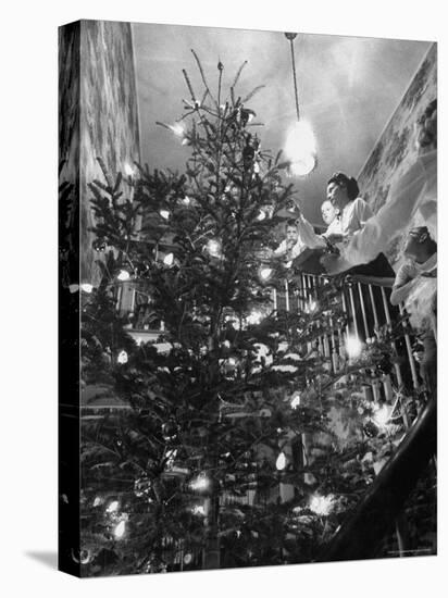 Mrs. George Sutton and Her Family Decorating Their Christmas Tree at Home-Ralph Crane-Premier Image Canvas