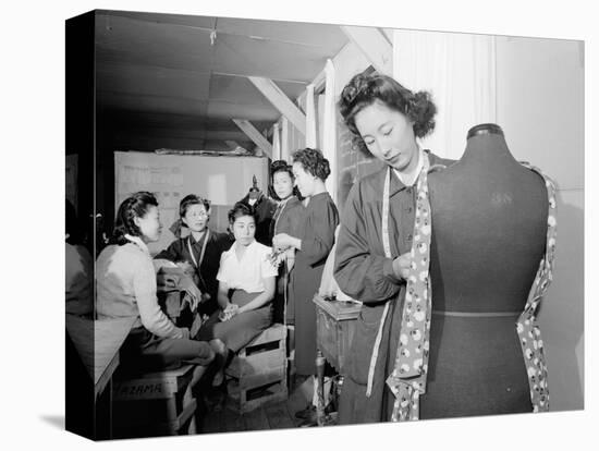 Mrs. Ryie Yoshizawa teaching a dressmaking class to women students at Manzanar, 1943-Ansel Adams-Premier Image Canvas