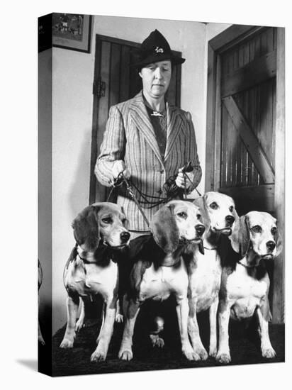 Mrs. William Dupont Jr. Holding Reins of Four Beagles That Belonged to Her Late Husband-Hansel Mieth-Premier Image Canvas