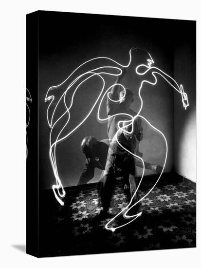 Multiple Exposure of Artist Pablo Picasso Using Flashlight to Make Light Drawing of a Figure-Gjon Mili-Premier Image Canvas