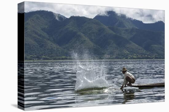 Myanmar, Inle Lake. Man Slaps His Paddle on the Surface of the Lake to Stun the Fish-Brenda Tharp-Premier Image Canvas