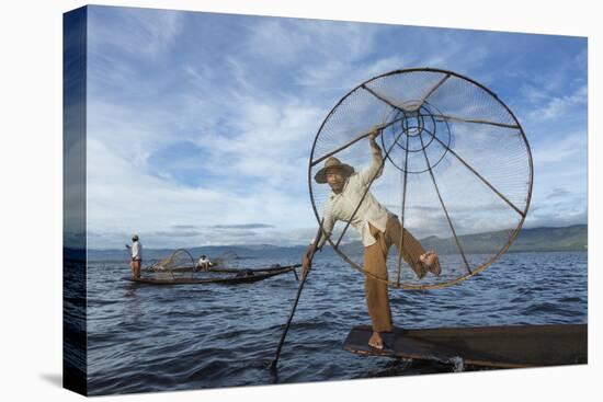 Myanmar, Inle Lake. Young Fisherman Demonstrates a Traditional Rowing Technique-Brenda Tharp-Premier Image Canvas