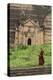 Myanmar, Mingun. a Young Monk Walking Beneath a Massive Temple Wall at Ruins of Mingun Pahtodawgyi-Brenda Tharp-Premier Image Canvas