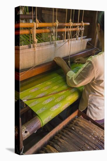 Myanmar. Shan State. Inle Lake. Woman weaving silk at a wooden loom.-Inger Hogstrom-Premier Image Canvas