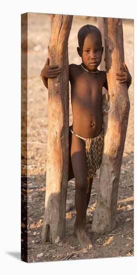 Namibia, Opuwo. Young Himba child in late afternoon light.-Wendy Kaveney-Premier Image Canvas
