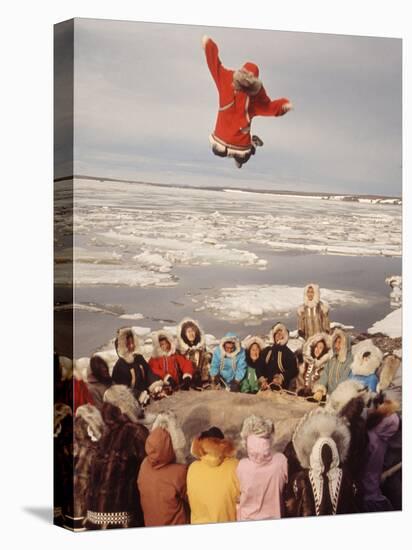 Native Alaskans Playing a Game of Nulukatuk, in Which Individals are Tossed into the Air-Ralph Crane-Premier Image Canvas