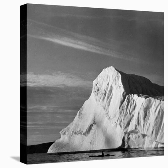 Native Man in Kayak Sitting in Water Next to Iceberg-null-Premier Image Canvas