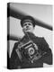 Navy Soldier Holding Camera-George Strock-Premier Image Canvas