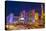 Neon Lights on Las Vegas Strip at Dusk with Car Headlights Leaving Streaks of Light-Eleanor Scriven-Premier Image Canvas