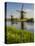 Netherlands, Kinderdijk, Windmills with evening light along the canals.-Terry Eggers-Premier Image Canvas