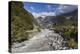 New Zealand, South Island, Fox Glacier Village, Fox Glacier hikers along Fox River-Walter Bibikow-Premier Image Canvas