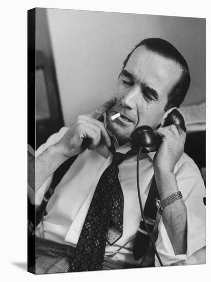 News Commentator, Edward R. Murrow with cigarette in mouth, tie loose, resting in his chair-Lisa Larsen-Premier Image Canvas