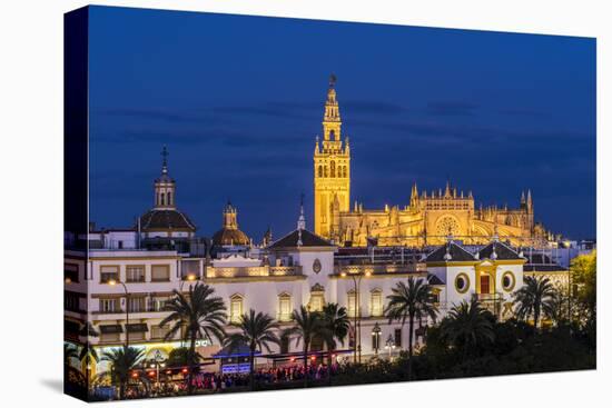 Night view of city skyline with Cathedral and Giralda bell tower, Seville, Andalusia, Spain-Stefano Politi Markovina-Premier Image Canvas