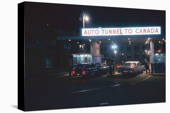 Nighttime View of the Cars at the Entrance to the Detroit-Windsor Tunnel, Detroit, Michigan, 1959-Fritz Goro-Premier Image Canvas