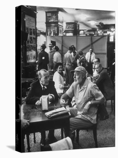 Noel Coward Chatting with Ernest Hemingway at Sloppy Joe's Bar-Peter Stackpole-Premier Image Canvas