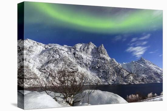 Northern Lights (Aurora Borealis) Illuminate the Snowy Peaks and the Blue Sky During a Starry Night-Roberto Moiola-Premier Image Canvas