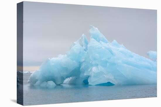 Norway. Svalbard. Brasvelbreen. Turquoise Ice Bergs in the Calm Water-Inger Hogstrom-Premier Image Canvas
