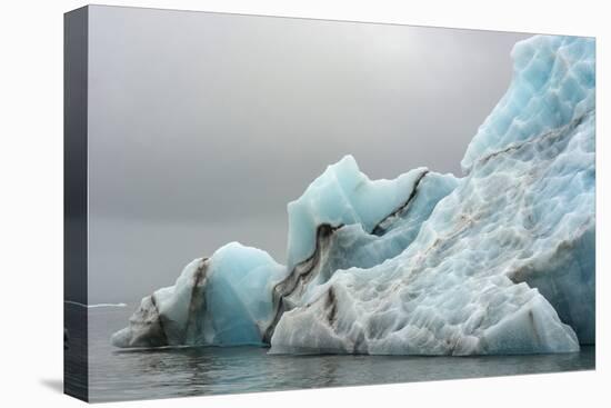 Norway. Svalbard. Spitsbergen. Brepollen. Iceberg with Moraine Dust-Inger Hogstrom-Premier Image Canvas