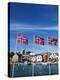 Norwegian Flags and Historic Harbour Warehouses, Stavanger, Norway, Scandinavia, Europe-Christian Kober-Premier Image Canvas