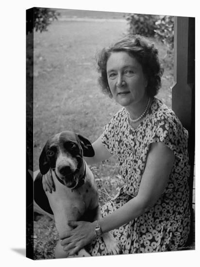 Novelist Marjorie K. Rawlings Petting Her Dog-Nina Leen-Premier Image Canvas