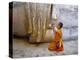 Novice Buddhist Monk Kneeling Beneath the Phra Atchana Buddha Statue, Sukhothai Province, Thailand-Gavin Hellier-Premier Image Canvas