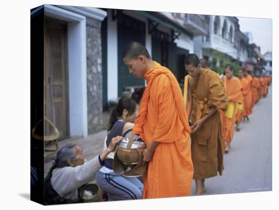 Novice Buddhist Monks Collecting Alms of Rice, Luang Prabang, Laos, Indochina, Southeast Asia, Asia-Upperhall Ltd-Premier Image Canvas