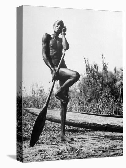 Nuer Tribesman Standing Like a Stork Next to His Canoe in a Papyrus Swamp-Eliot Elisofon-Premier Image Canvas