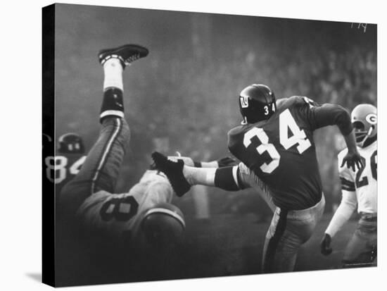 NY Giant Don Chandler Making a Punt in a Football Game Against the Green Bay Packers-John Loengard-Premier Image Canvas