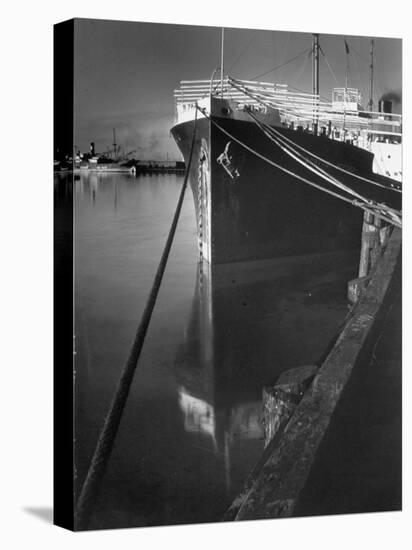 Oil Tanker Tied Up at Dock While it Is Being Loaded with Barrels of Oil-Margaret Bourke-White-Premier Image Canvas