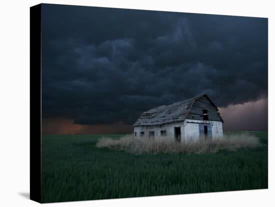 Old Barn Stands in a Wheat Field as a Thunderstorm Passes in the Distance Near Ogallah, Kansas-null-Premier Image Canvas