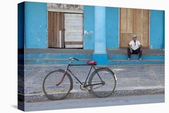 Old Bicycle Propped Up Outside Old Building with Local Man on Steps-Lee Frost-Premier Image Canvas