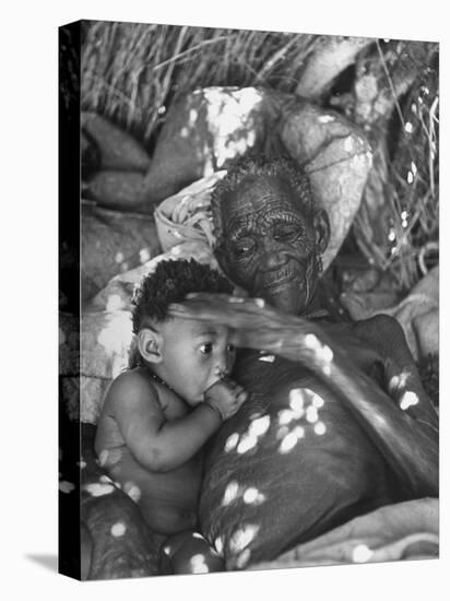 Old Bushman Woman Holding a Baby-null-Premier Image Canvas