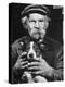 Old Man Holding His Hands around a Dog's Throat-Dmitri Kessel-Premier Image Canvas