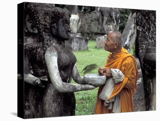 Old Monk Praying at Xieng Khuan (Buddha Park), Laos-Keren Su-Premier Image Canvas