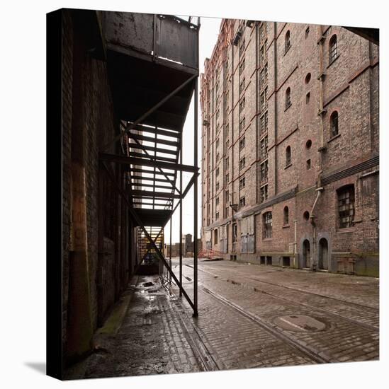 Old Tramlines in Cobbled Street with Shipping Warehouses in Liverpool, Merseyside, England, UK-Paul McMullin-Stretched Canvas