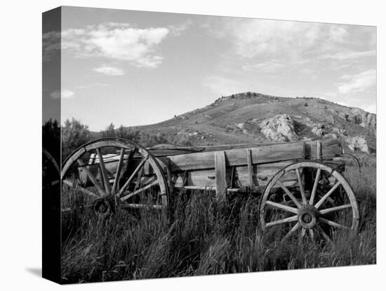 Old Wood Wagon near Mining Ghost Town at Bannack State Park, Montana, USA-Jamie & Judy Wild-Premier Image Canvas