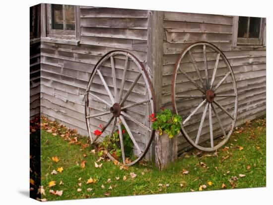 Old Wooden Barn with Wagon Wheels in Rural New England, Maine, USA-Joanne Wells-Premier Image Canvas