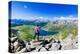 One man looking at the alpine lake of Montespluga standing on rocks, Madesimo-Roberto Moiola-Premier Image Canvas