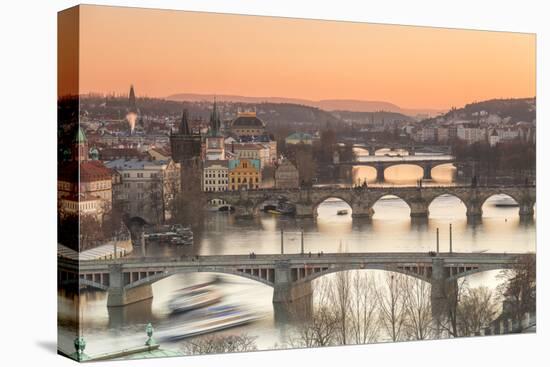Orange sky at sunset on the historical bridges and buildings reflected on Vltava River, Prague, Cze-Roberto Moiola-Premier Image Canvas