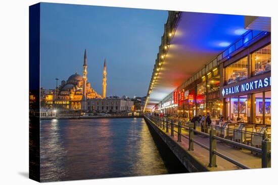 Outdoor Restaurants under Galata Bridge with Yeni Cami or New Mosque at Dusk, Istanbul-Stefano Politi Markovina-Premier Image Canvas