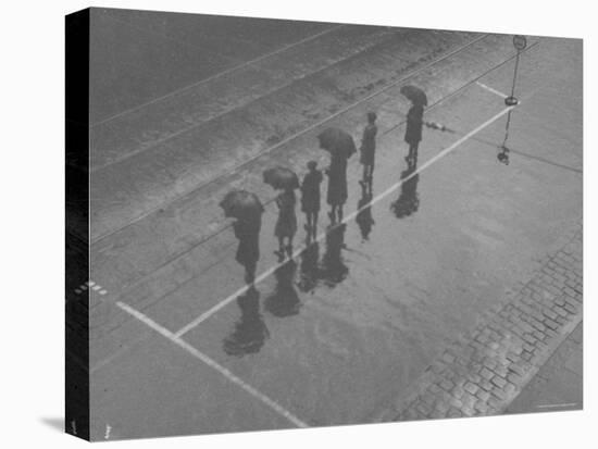 Overhead View of People with Umbrellas Waiting For the Tram, Melbourne, Australia-Emil Otto Hoppé-Premier Image Canvas