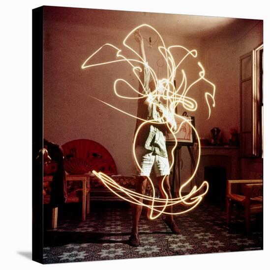 Pablo Picasso Creating Light Drawing of Vase of Flowers, Alone-Gjon Mili-Premier Image Canvas